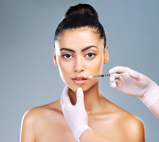 Woman Relaxing During Facial Treatment at Leor Clinic