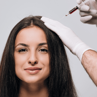 Woman receiving hairfall treatment