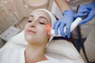 Woman receiving laser hair removal treatment