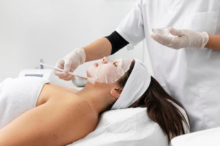 Woman receiving face mask treatment at Leor Clinic